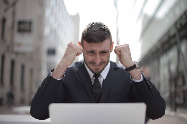 Canva - Man in Black Suit Achieved an Accomplishment